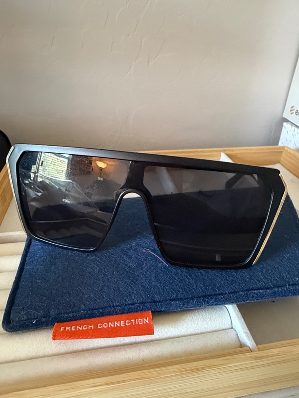 French Connection Glossy Black Shield Sunglasses with Gold Trim
